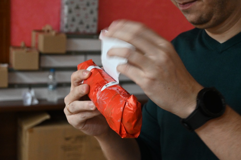 The excitement of unwrapping Secret Santa gifts